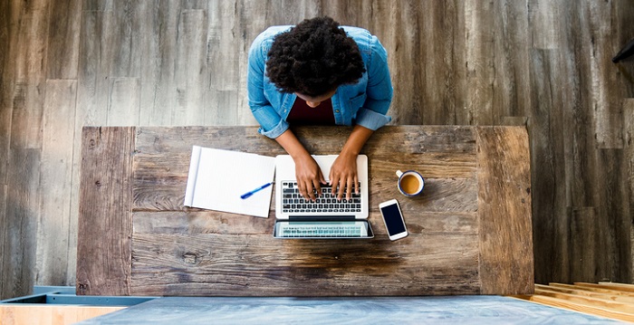 Overhead view of a woman using a computer